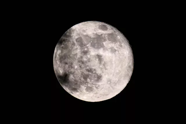 The "pink" super moon is a bit in the clouds