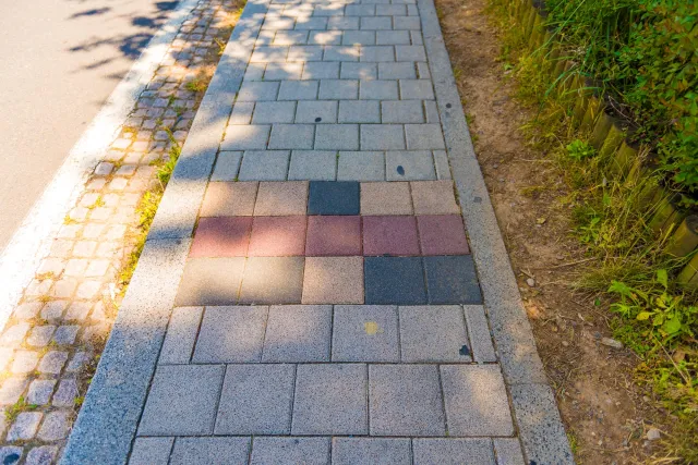 Black-red-gold in the sidewalk