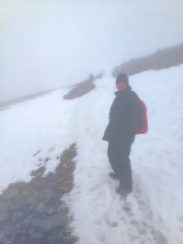 Karin on the way to the summit in the first snow